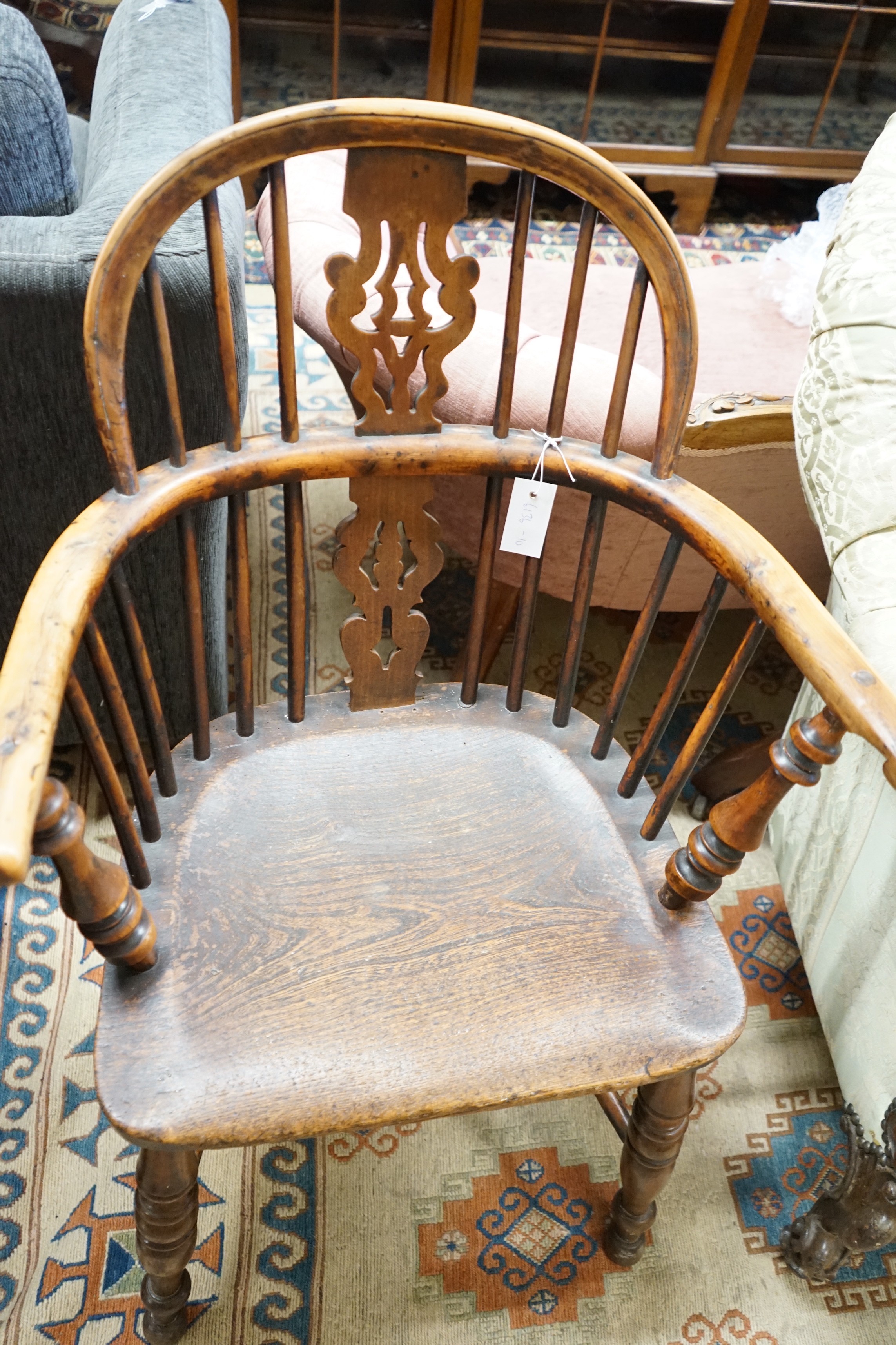 A mid 19th century Yorkshire area Windsor yew and elm elbow chair with crinoline stretcher, width 59cm, depth 39cm, height 94cm